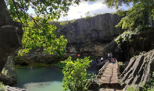 Explorers entering the cave behind Dray Nur during the dry season.
