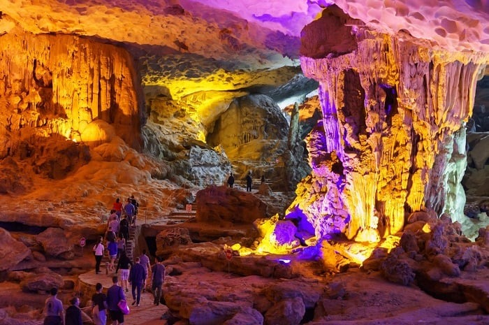 Visitors exploring the illuminated chambers of Sung Sot Cave