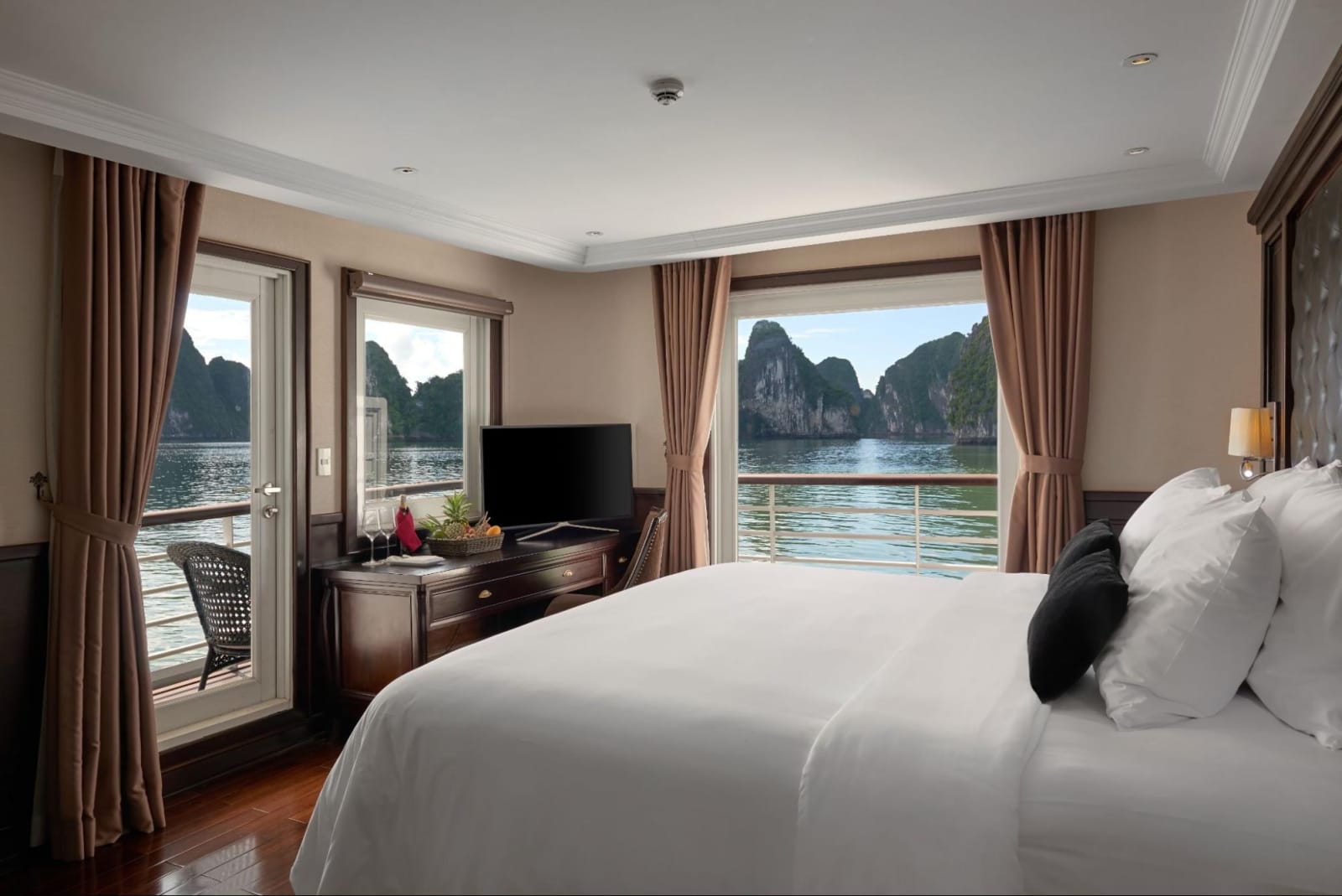 Elegant cabin on a Ha Long Bay cruise ship with a private balcony