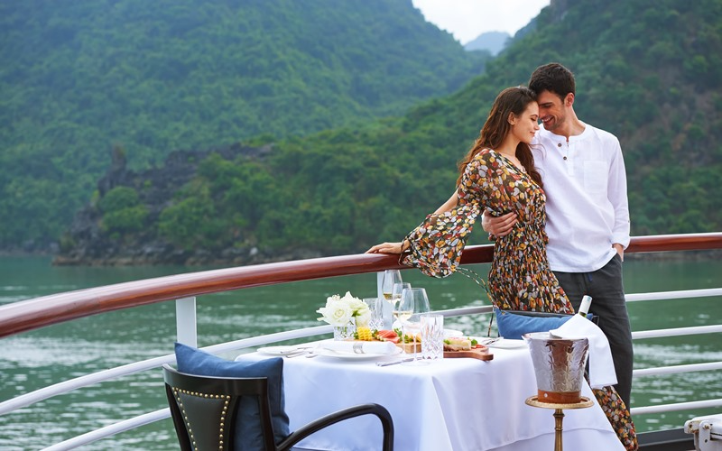 Private balcony dining between limestone peaks—an unforgettable first-night memory