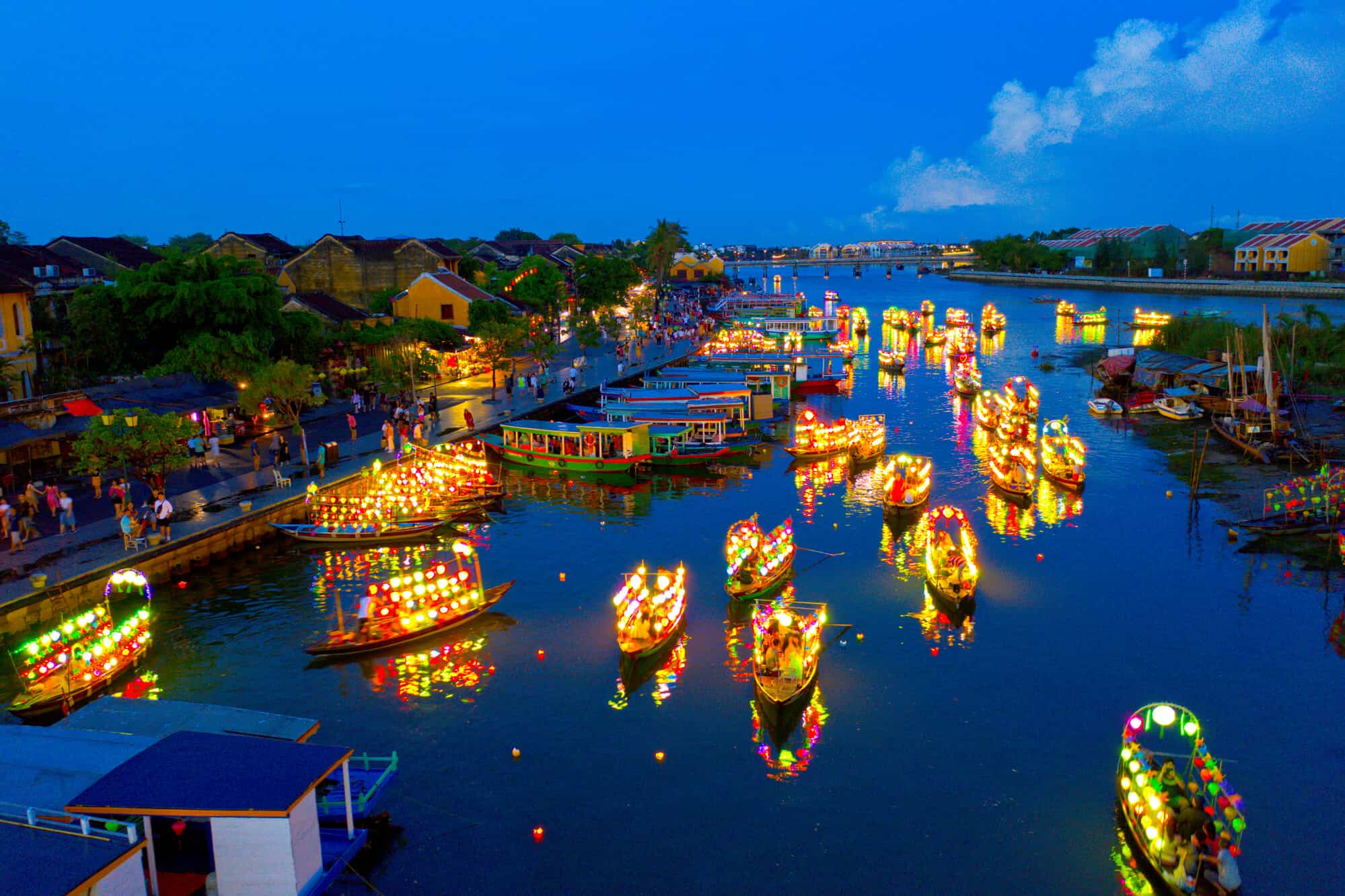 Lanterns reflecting on the Thu Bon River in the evening