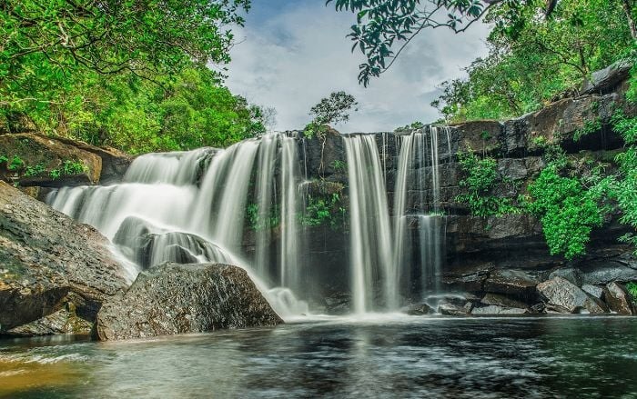 Gentle cascades of Suoi Tranh flowing through the jungle.
