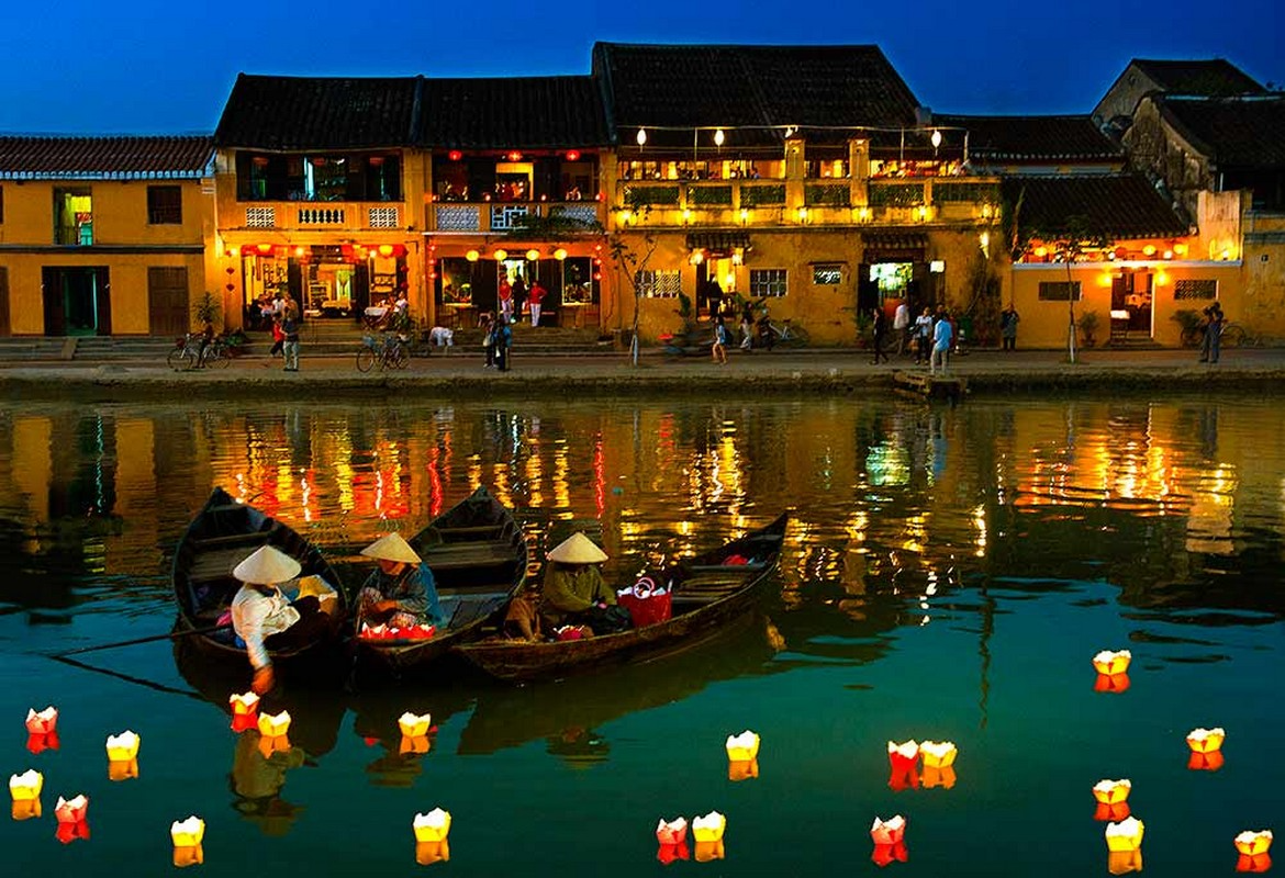 Floating lanterns on the Thu Bon River in Hoi An, a monthly ritual that transforms the ancient town.
